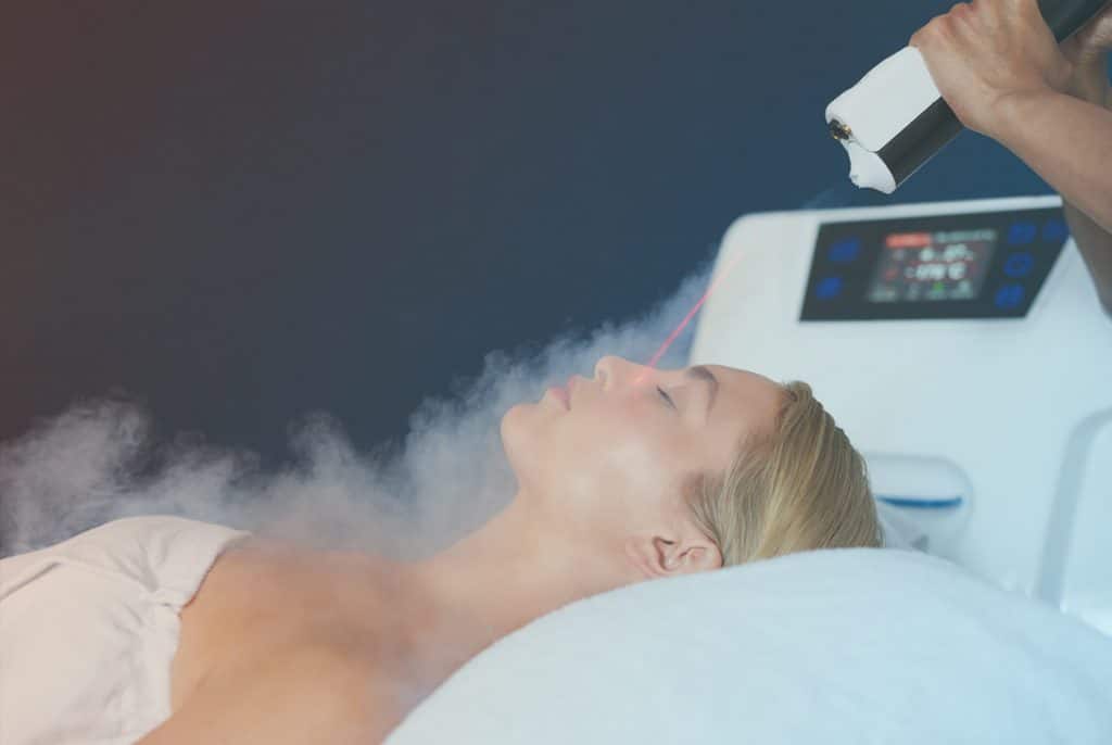 Female patient laying on a table getting Cryotherapy treatments.