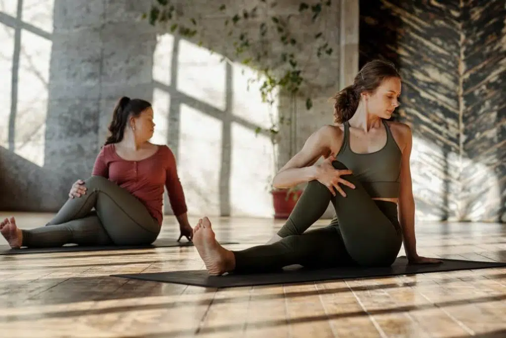 Two women doing stretching exercises