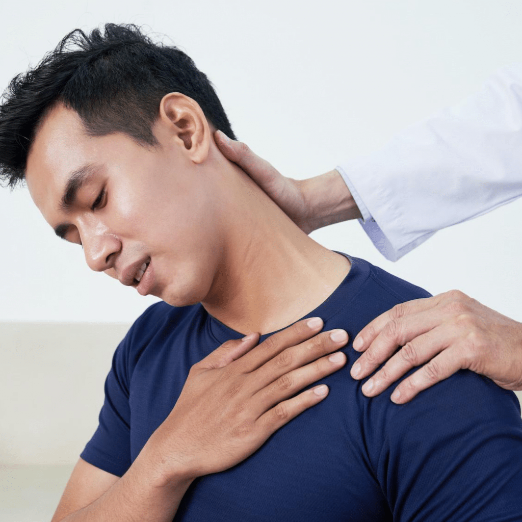Young man getting neck pain treatment at Zaker Chiropractic.