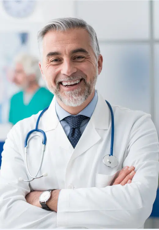 Photo of a pain management doctor smiling.