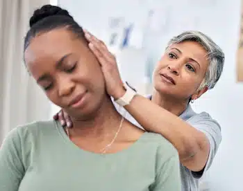 chiropractor doing neck adjustment o patient who had a car accident