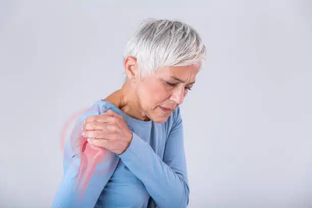 Woman suffers from shoulder pain.