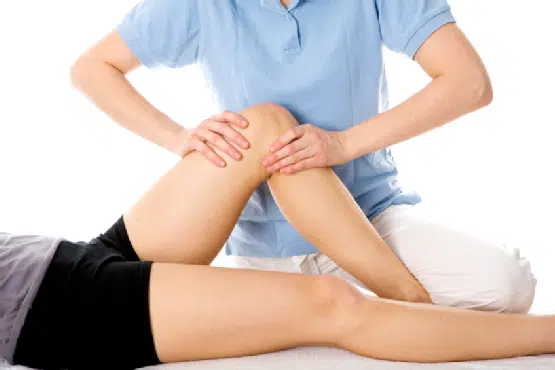 Chiropractor treating a patient with joint problem