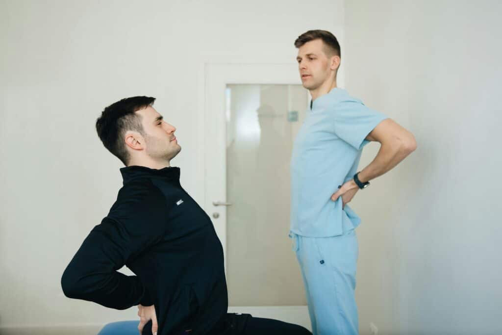 doctor teaching patient stretching techniques