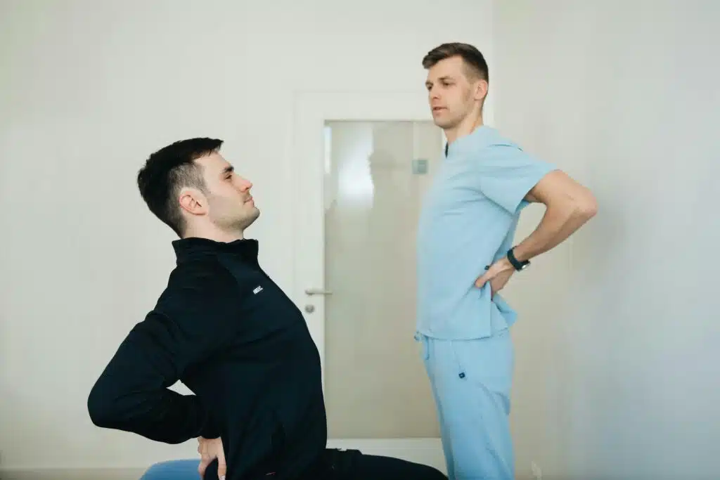 doctor teaching patient stretching techniques