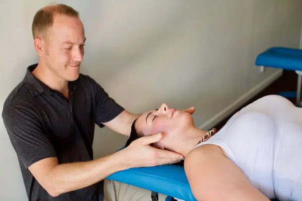 Chiropractor doing some chiropractic care to the patient