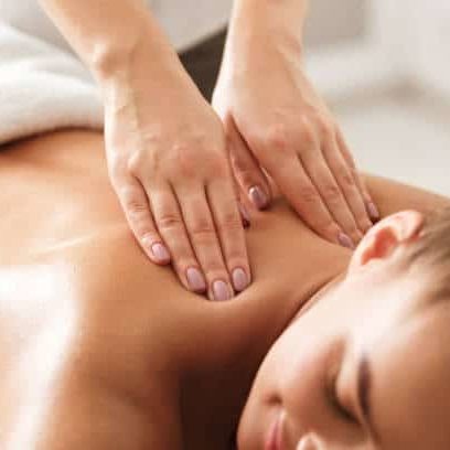 cropped image of a patient's back getting massage therapy