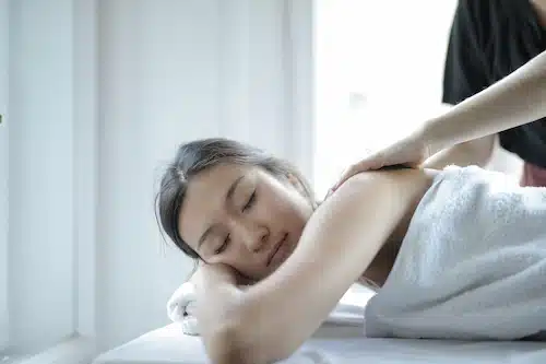woman relaxed and asleep during massage therapy