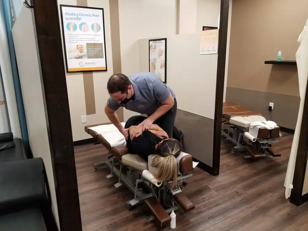 chiropractor is doing some chiropractic treatment to the patient.