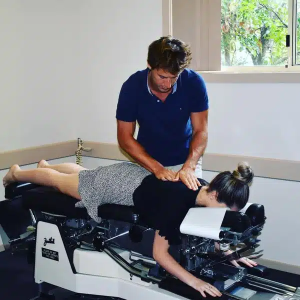 Chiropractor doing some spinal decompression treatment to the patient.