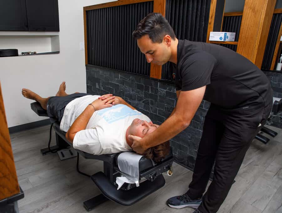 Chiropractor Perform Chiropractic Adjustments to his Patient		