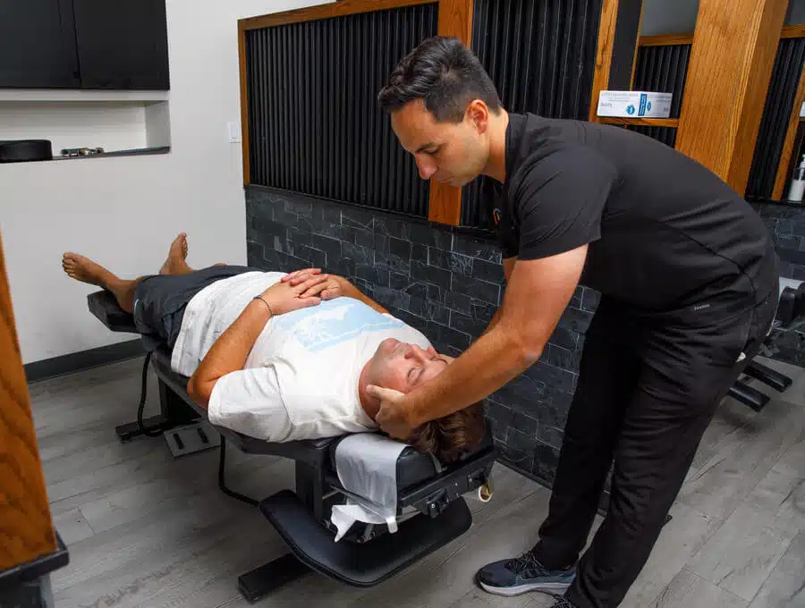 Dr. Zaker treats a patient who suffers from neck injuries at Zaker Chiropractic.