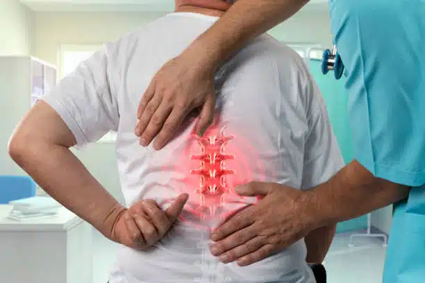 Patient getting into a medical evaluation in a chiropractic clinic.