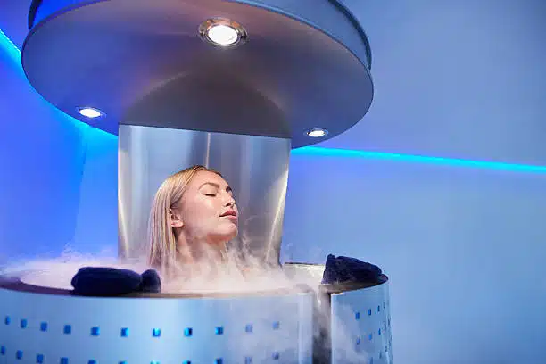 Female getting cryo therapy at the chiropracti clinic.