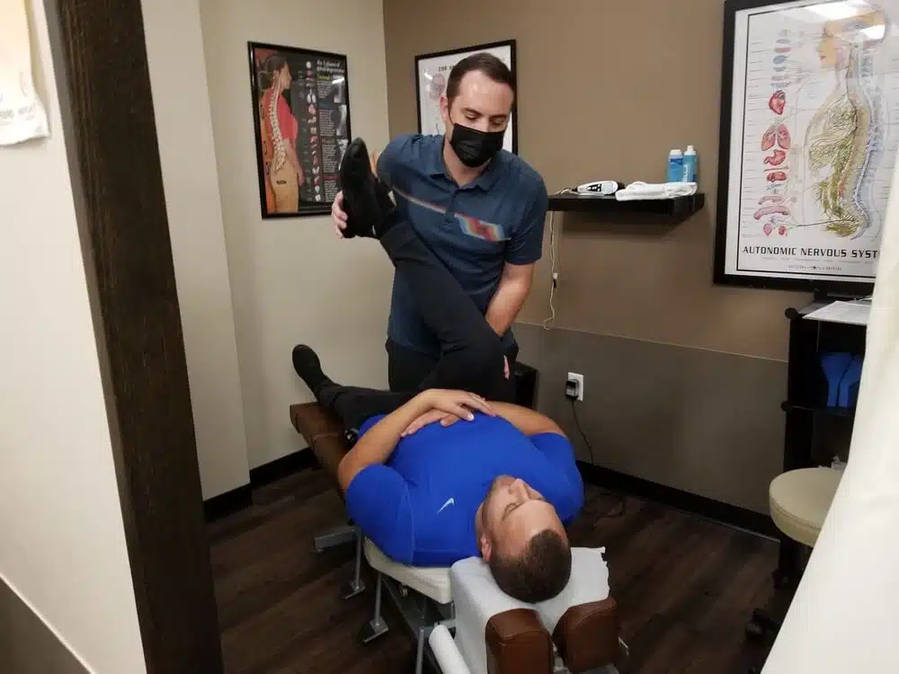 Chiropractor is having an evaluation and treatment  to a patient who suffers from work injury.