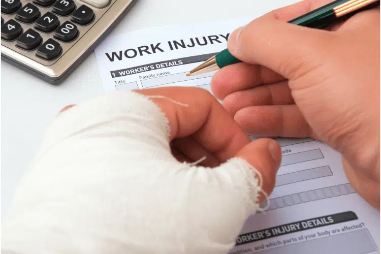 Worker filling in the worker's injury claim form at the Office of Workers' Compensations Programs.