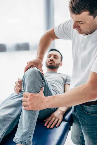 Expert and Experienced Chiropractor applying treatment to injured dock worker