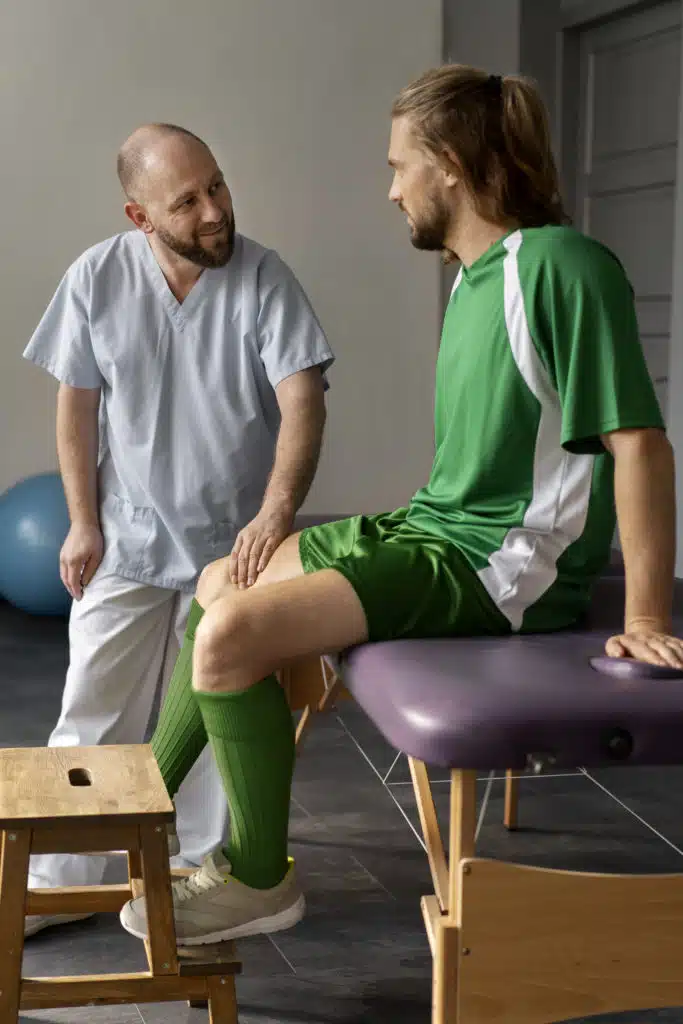 Physiotherapist examining athlete Legs Due to sport Injury