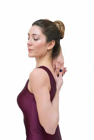 woman doing stretching for stress management and to relief neck pain