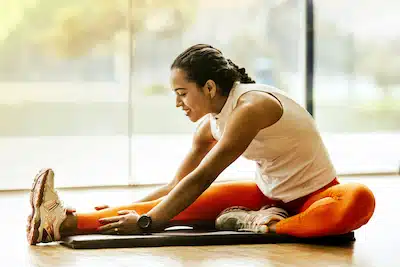 woman with healthy lifestyle doing a back stretch