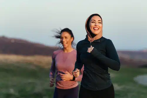 two women running outside