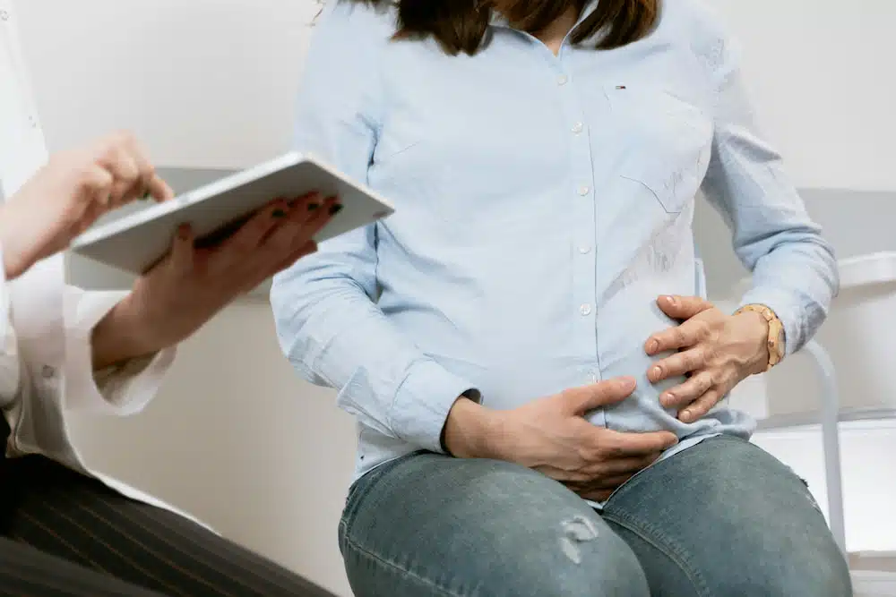 Pregnant woman initial consultation in a chiropractic clinic
