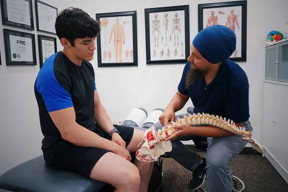 Chiropractor explaining the diagnosis to the patient