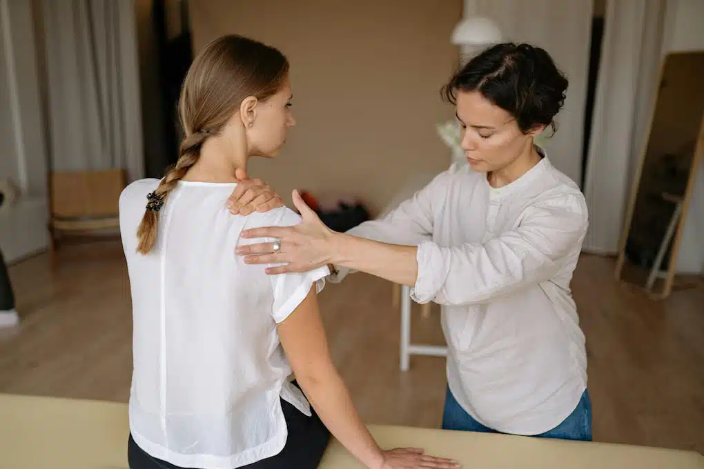 Patient is having a shoulder chiropractic adjustment in a chiropractic clinic