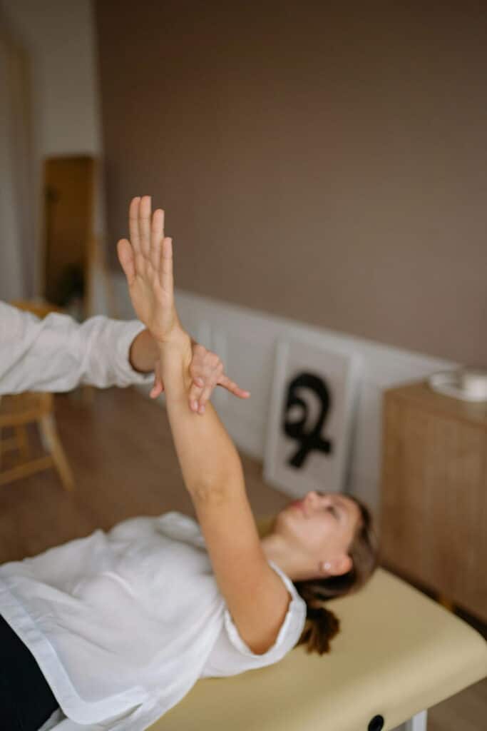 Woman having physiotherapy session in a chiropractic clinic 