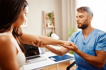 young woman getting examined by a chiropractor