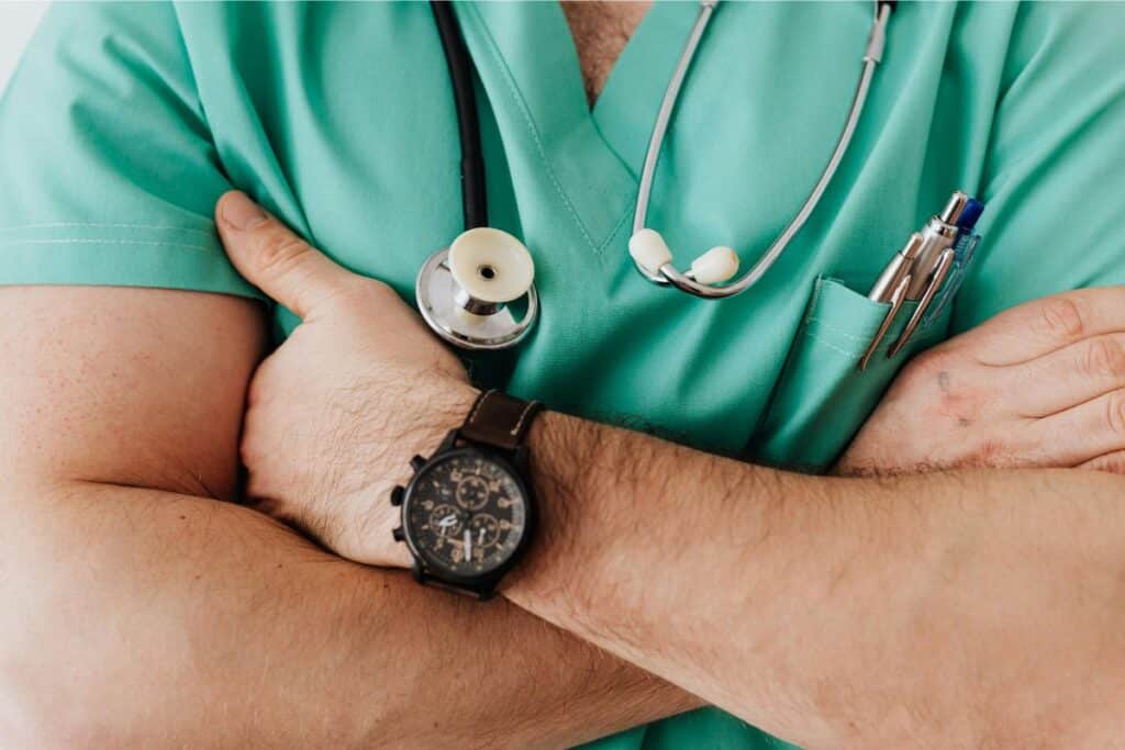 Close-Up Shot of a Doctor Wearing a Lab Coat and Stethoscope