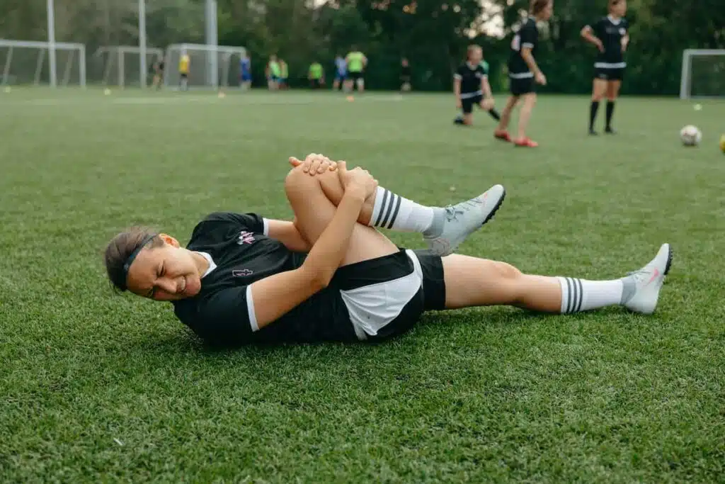 Injured Athlete Lying on a Soccer Field
