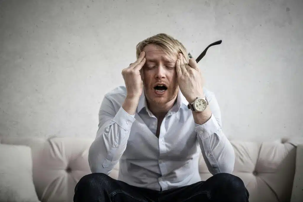 Photo Of Man Touching His Head
