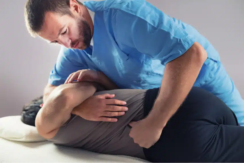 Chiropractor doing some spinal and back adjustment to the patient