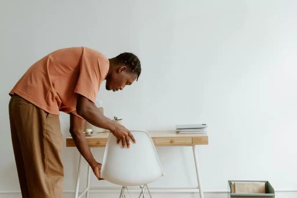 A man adjusting chair 