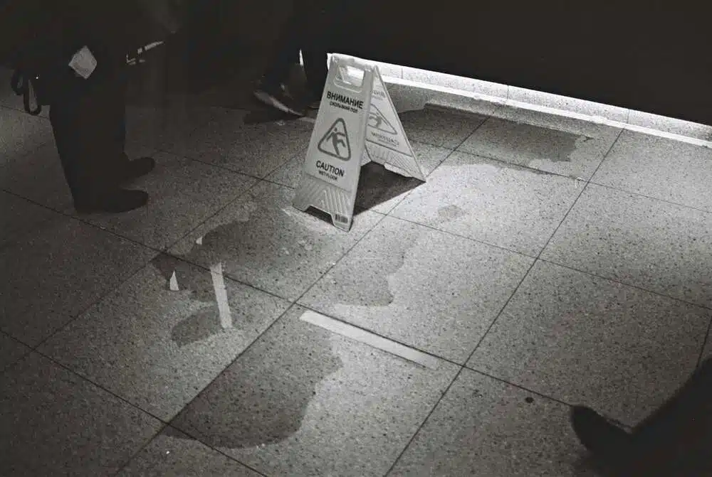 Black and White Photography of Floor Sign Board